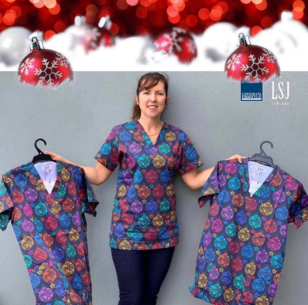 Our Christmas scrub is a Cotton v-neck top with twin side pockets and chest pockets available in sizes XS to 2XL.  Corporate Profile Clothing FreeCall 1800 654 990